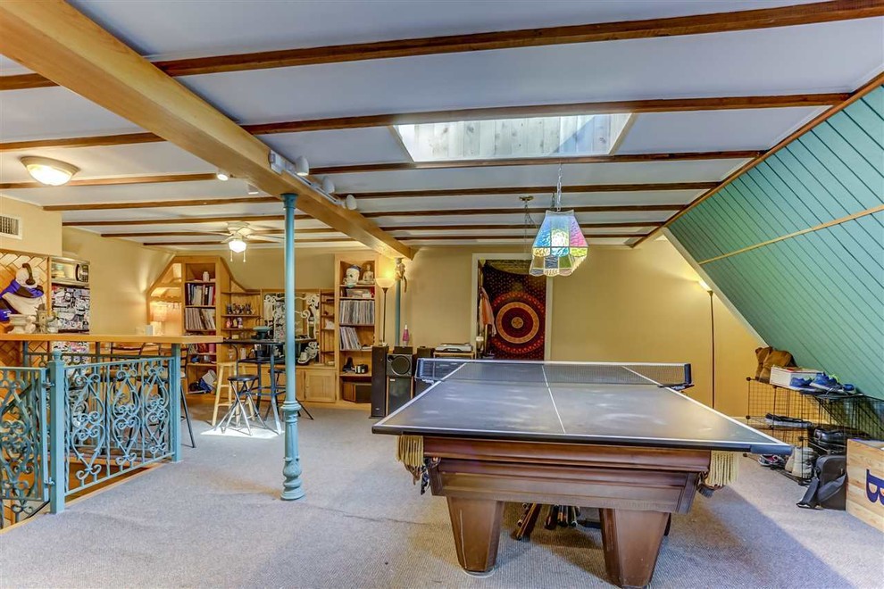 Large eclectic enclosed games room in Other with a game room, white walls, carpet and no fireplace.