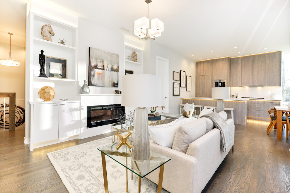 Imagen de sala de estar contemporánea con paredes blancas, suelo de madera clara, todas las chimeneas y suelo marrón