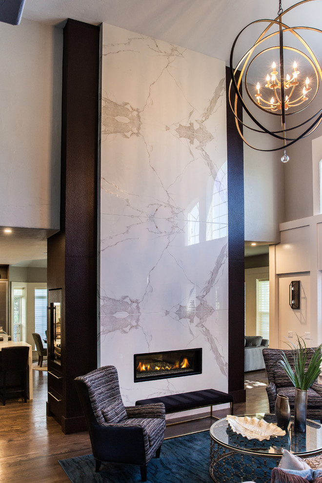 Example of a large trendy open concept dark wood floor family room design in Denver with a two-sided fireplace, a tile fireplace and a media wall