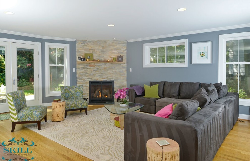 Large minimalist open concept light wood floor family room photo in DC Metro with a corner fireplace and a stone fireplace