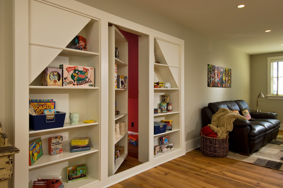 Example of a mountain style medium tone wood floor family room design in New York with beige walls