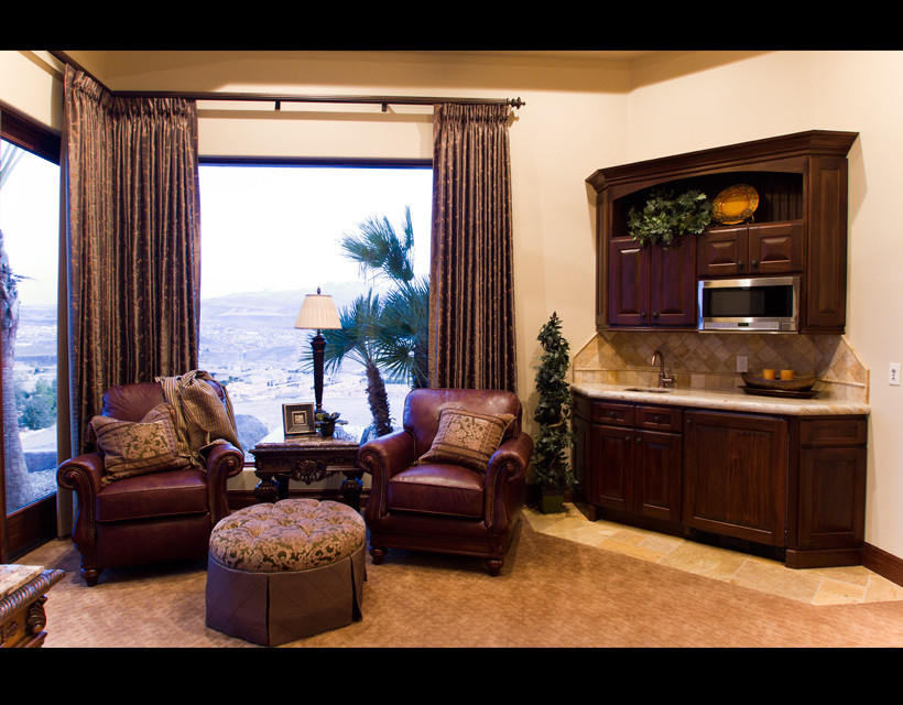 This is an example of a large classic open plan games room in Salt Lake City with a home bar, beige walls and carpet.