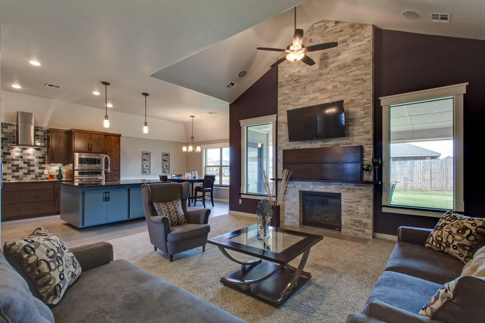 Example of a minimalist open concept carpeted family room design in Oklahoma City with purple walls, a standard fireplace, a tile fireplace and a wall-mounted tv