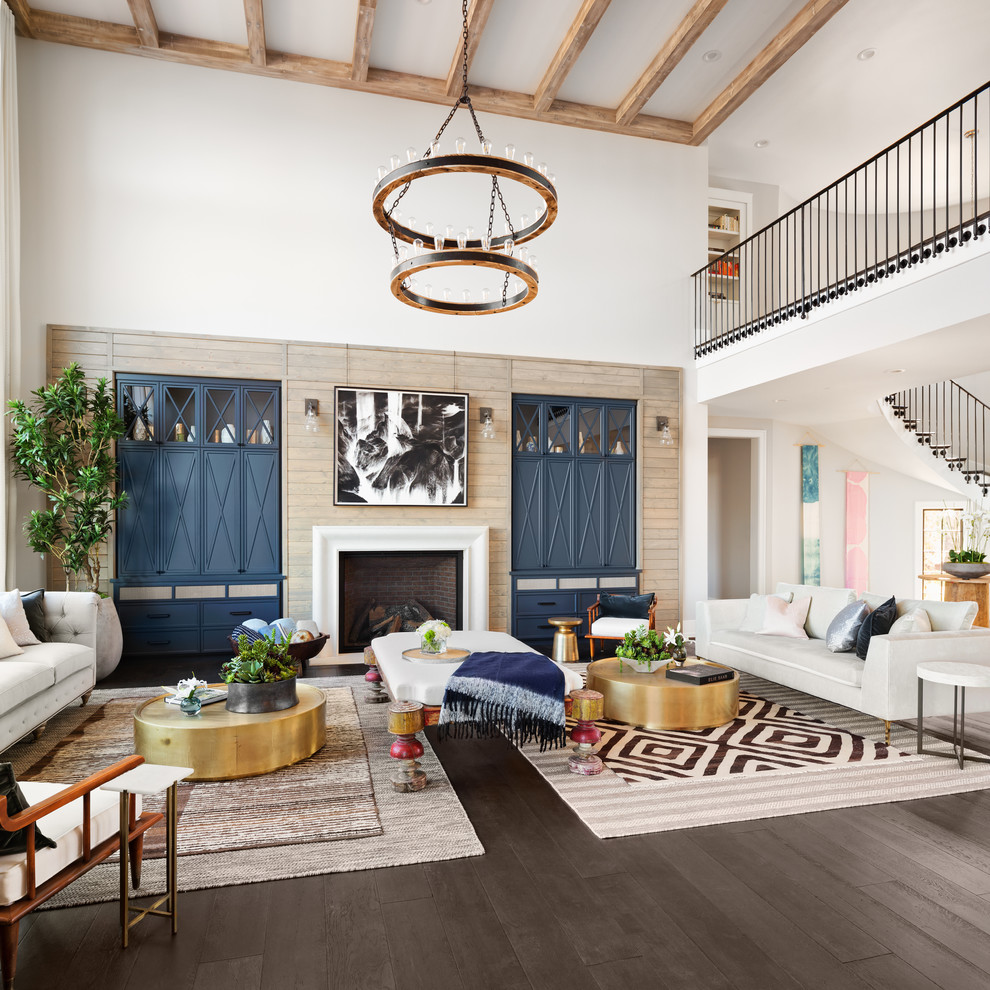 Traditional open plan games room in Portland with white walls, dark hardwood flooring, a standard fireplace and brown floors.