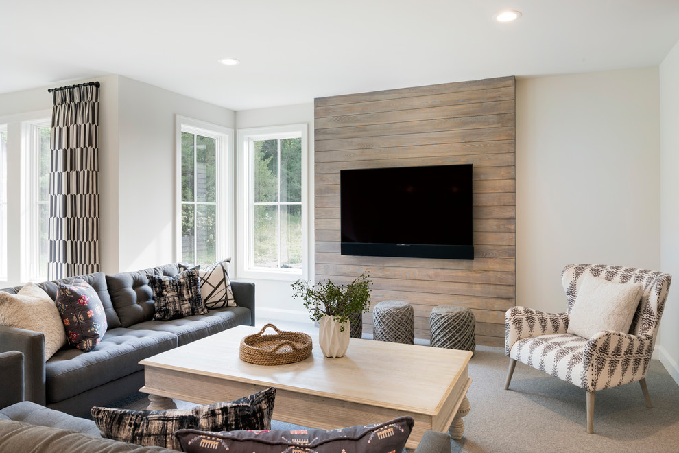 ミネアポリスにある広いトランジショナルスタイルのおしゃれなオープンリビング (ホームバー、白い壁、カーペット敷き、壁掛け型テレビ、グレーの床、暖炉なし) の写真