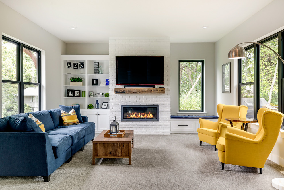 Inspiration for a large transitional carpeted and gray floor family room remodel in Minneapolis with gray walls, a wall-mounted tv and a ribbon fireplace