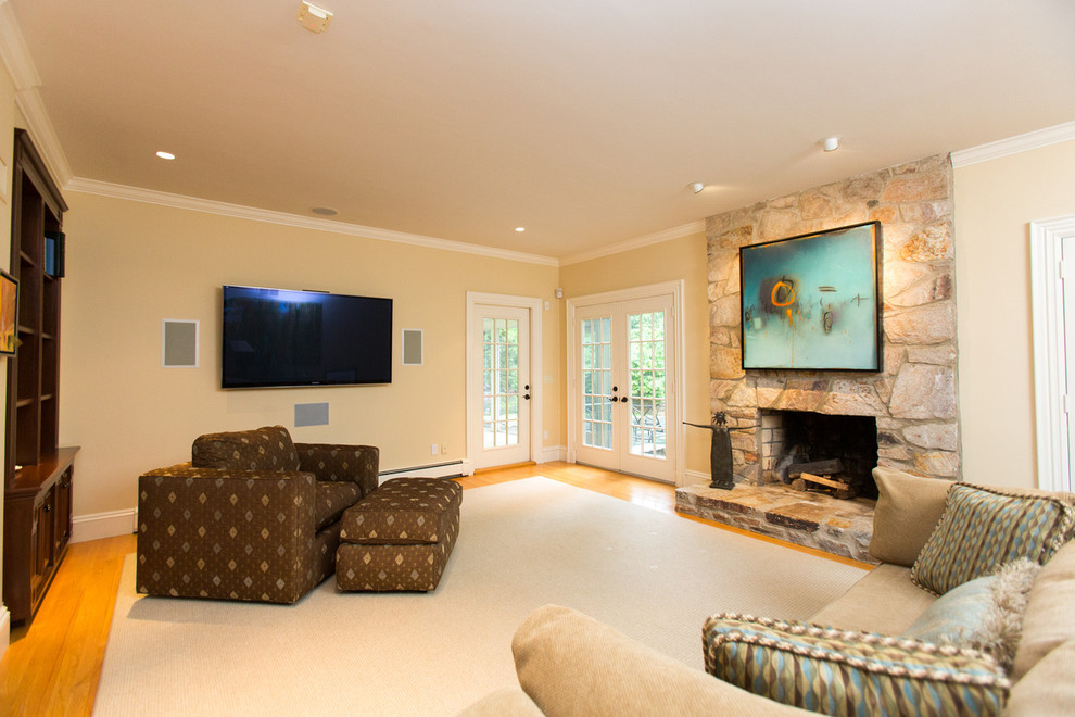 Contemporary enclosed games room in Boston with a game room, green walls, light hardwood flooring, a standard fireplace, a stone fireplace surround and a wall mounted tv.