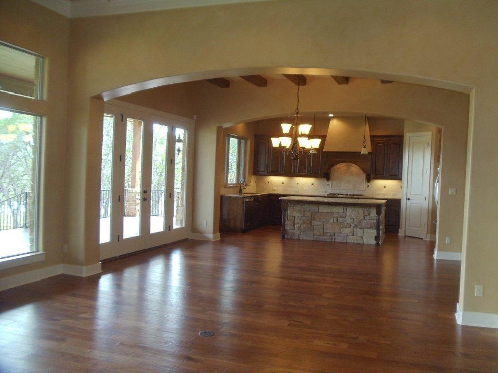 Tuscan family room photo in Austin