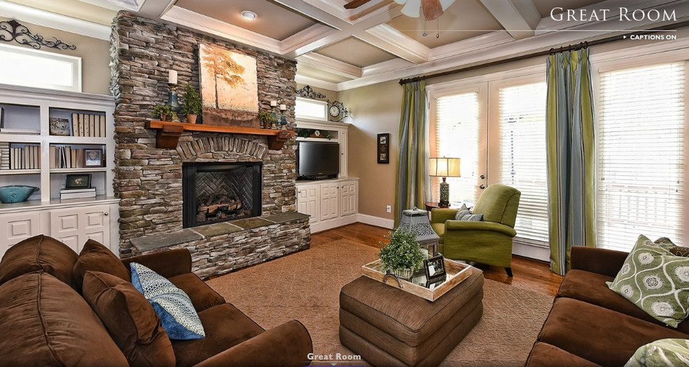 Mid-sized arts and crafts open concept medium tone wood floor family room photo in Charlotte with a corner tv, beige walls, a standard fireplace and a stone fireplace