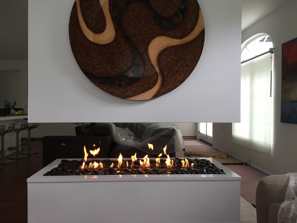 4 SIDED FLOATING FIREPLACE! Modern Family Room Orlando by