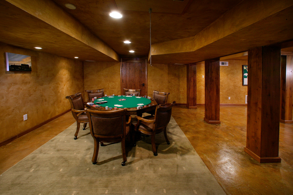 Huge elegant open concept concrete floor game room photo in Sacramento with brown walls, no fireplace and no tv