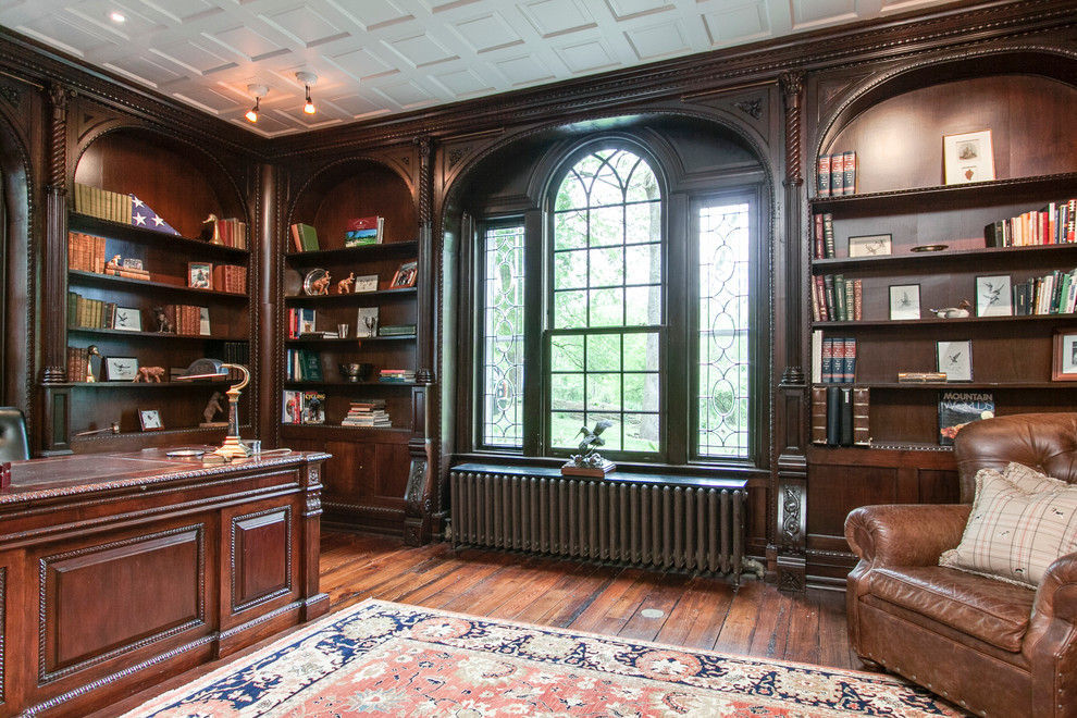 Inspiration for a timeless dark wood floor family room library remodel in Philadelphia with a standard fireplace and a stone fireplace