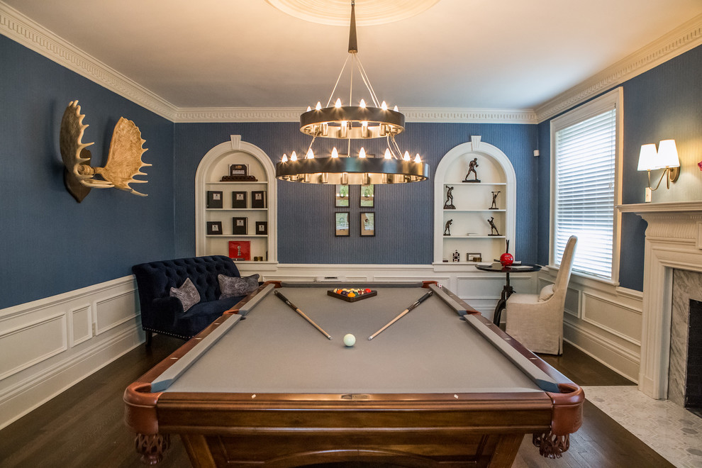 Victorian enclosed games room in Charlotte with multi-coloured walls, dark hardwood flooring, a standard fireplace, a stone fireplace surround, no tv, brown floors and a dado rail.