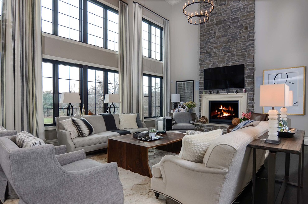 Design ideas for a large contemporary open plan games room in Baltimore with grey walls, dark hardwood flooring, a standard fireplace, a stone fireplace surround and a wall mounted tv.