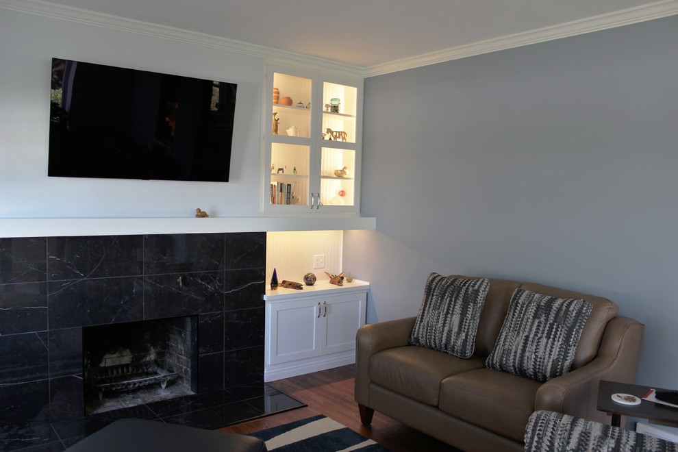Photo of a medium sized classic games room in Other with a standard fireplace and a tiled fireplace surround.