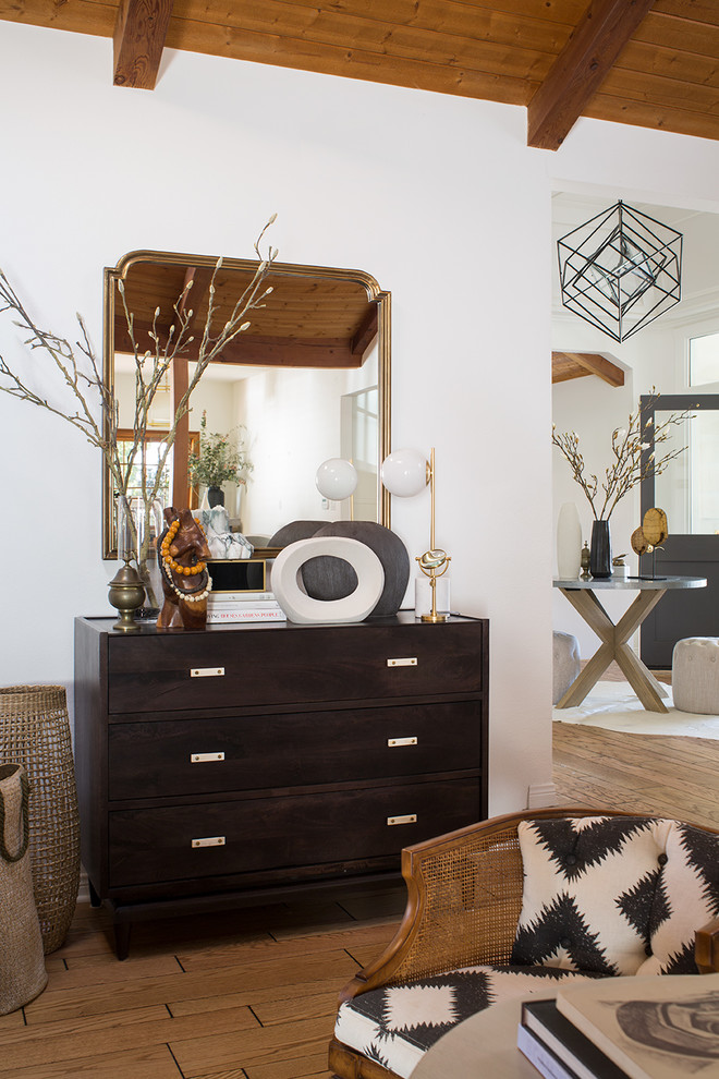 Mid-sized transitional open concept light wood floor and brown floor family room photo in Los Angeles with white walls, a standard fireplace, a brick fireplace and a concealed tv