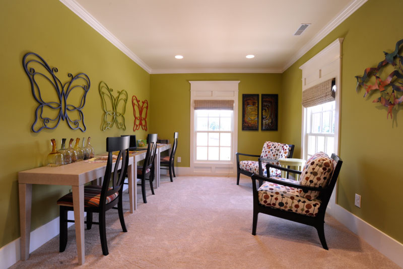 Inspiration for a timeless gender-neutral carpeted and beige floor kids' study room remodel in Columbus with green walls