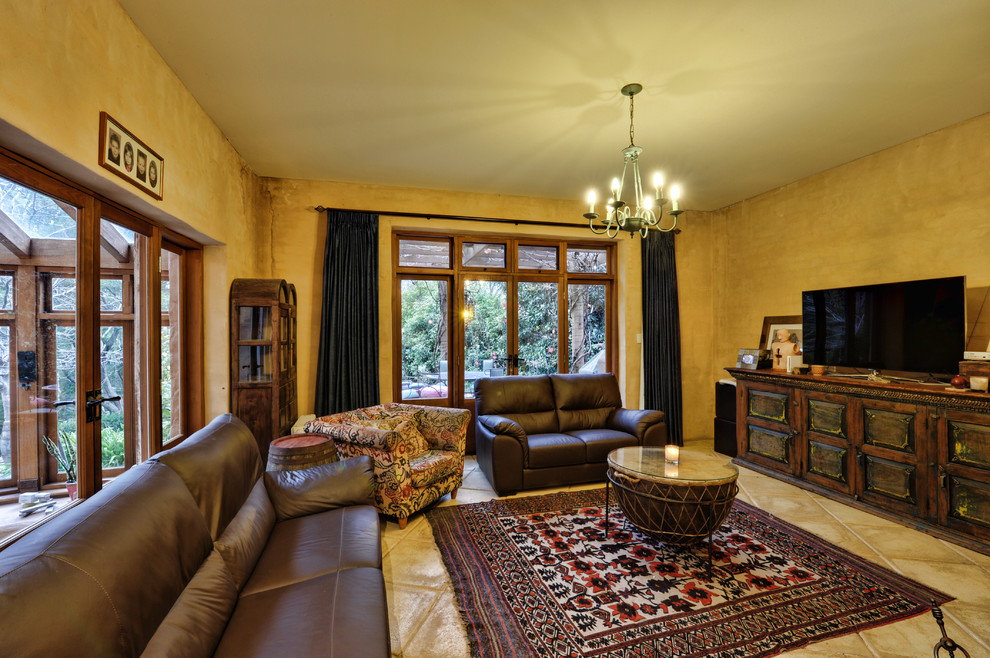 Photo of a large rustic games room in Adelaide with ceramic flooring and a freestanding tv.