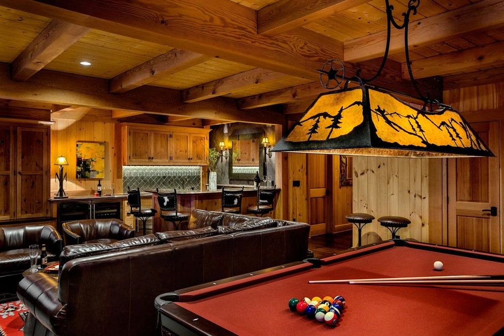 This is an example of a large contemporary open plan games room in Burlington with a game room, brown walls, dark hardwood flooring, a standard fireplace, a stone fireplace surround and a built-in media unit.