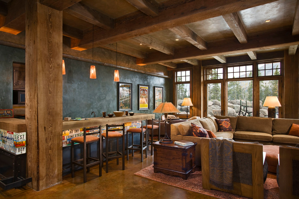 Example of a mountain style family room design in Other with gray walls and a bar
