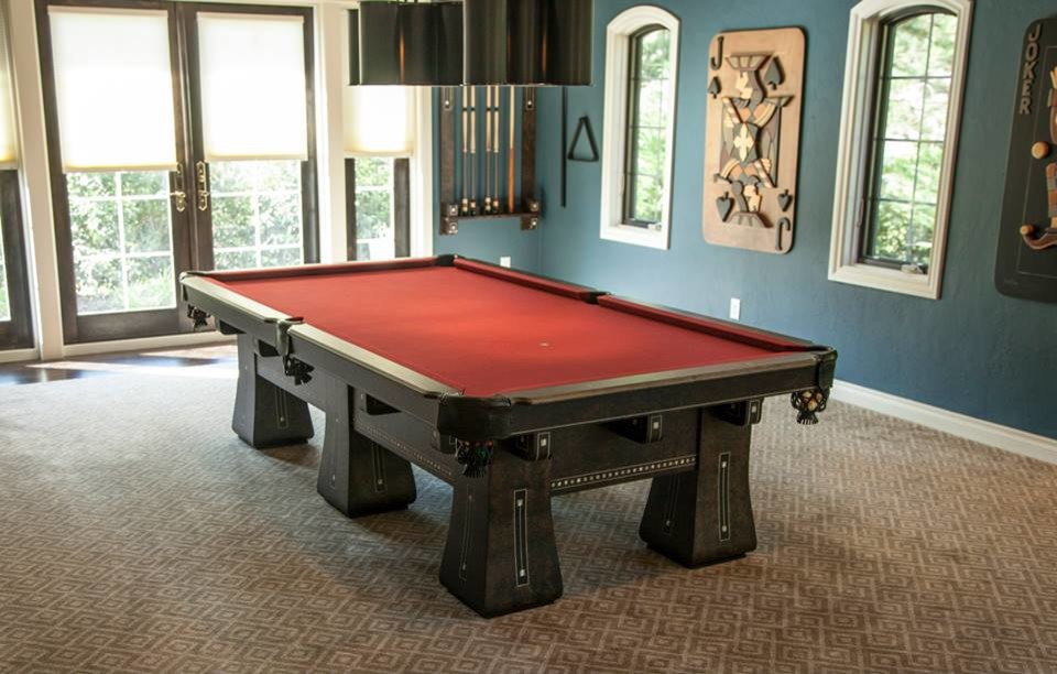 Photo of a medium sized traditional enclosed games room in Orange County with a game room, blue walls and carpet.