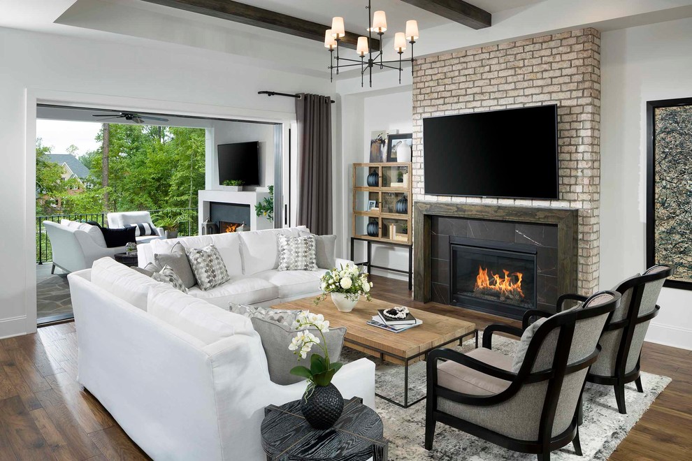 Example of a transitional open concept dark wood floor and brown floor family room design in Charlotte with white walls, a ribbon fireplace, a stone fireplace and a wall-mounted tv