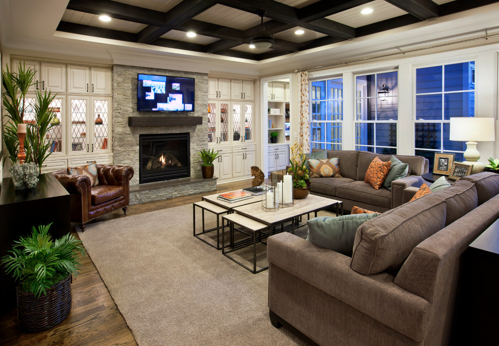 Family room - mid-sized traditional light wood floor family room idea in Raleigh with a standard fireplace, a wall-mounted tv, white walls and a stone fireplace