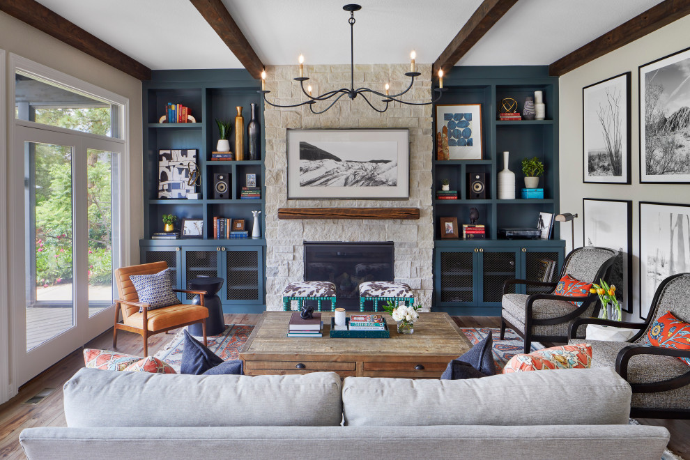 Family room - large transitional open concept medium tone wood floor and brown floor family room idea in Denver with gray walls, a standard fireplace, a stone fireplace and a wall-mounted tv