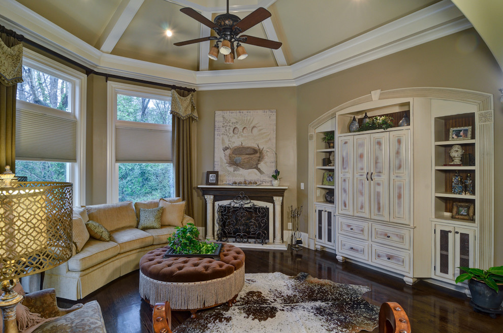 Design ideas for a medium sized traditional open plan games room in Atlanta with beige walls, dark hardwood flooring, a corner fireplace, a stone fireplace surround and a built-in media unit.