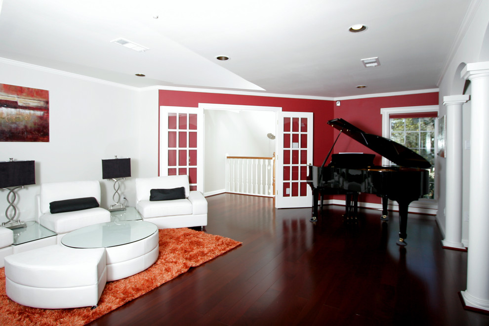Inspiration for a large contemporary open concept family room remodel in Houston with a music area, red walls and a wall-mounted tv