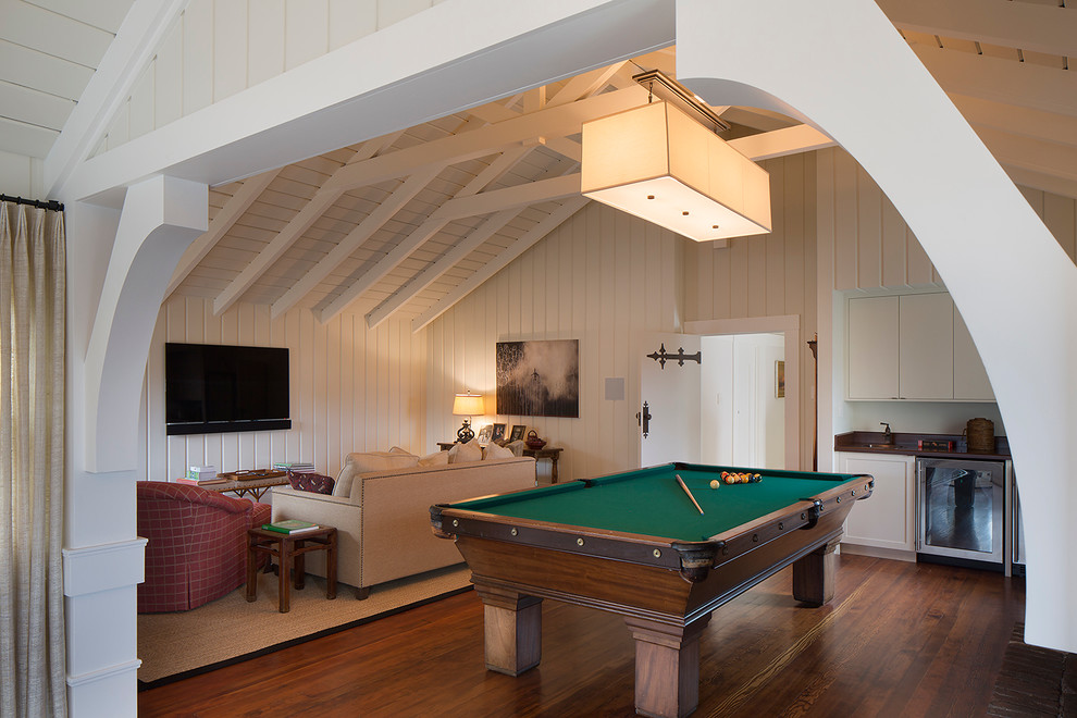 Large traditional enclosed games room in San Francisco with white walls, dark hardwood flooring and a wall mounted tv.