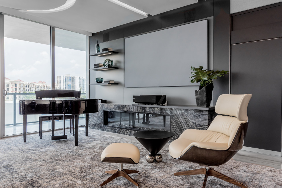 This is an example of a contemporary games room in Miami with a music area.