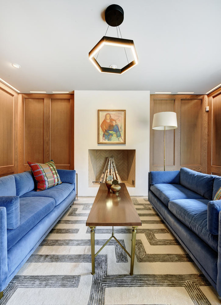 Inspiration for a large traditional enclosed games room in Austin with a standard fireplace, a plastered fireplace surround, brown walls, concrete flooring, no tv and grey floors.