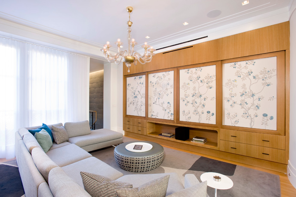 Стильный дизайн: гостиная комната в современном стиле с скрытым телевизором - последний тренд