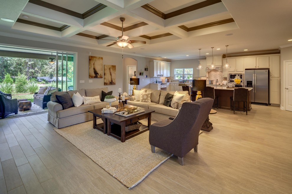 Example of a large transitional open concept laminate floor family room design in Jacksonville with gray walls