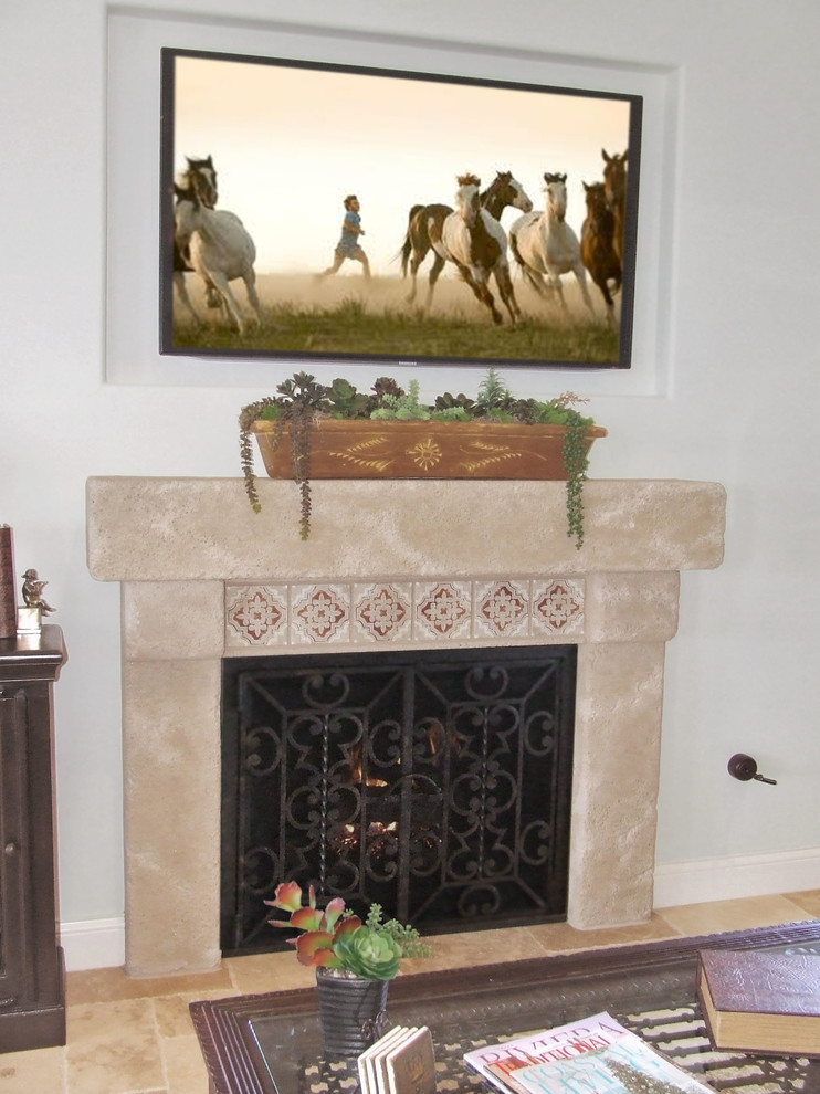 Inspiration for a rustic enclosed games room in San Diego with grey walls, travertine flooring, a standard fireplace, a stone fireplace surround and a wall mounted tv.