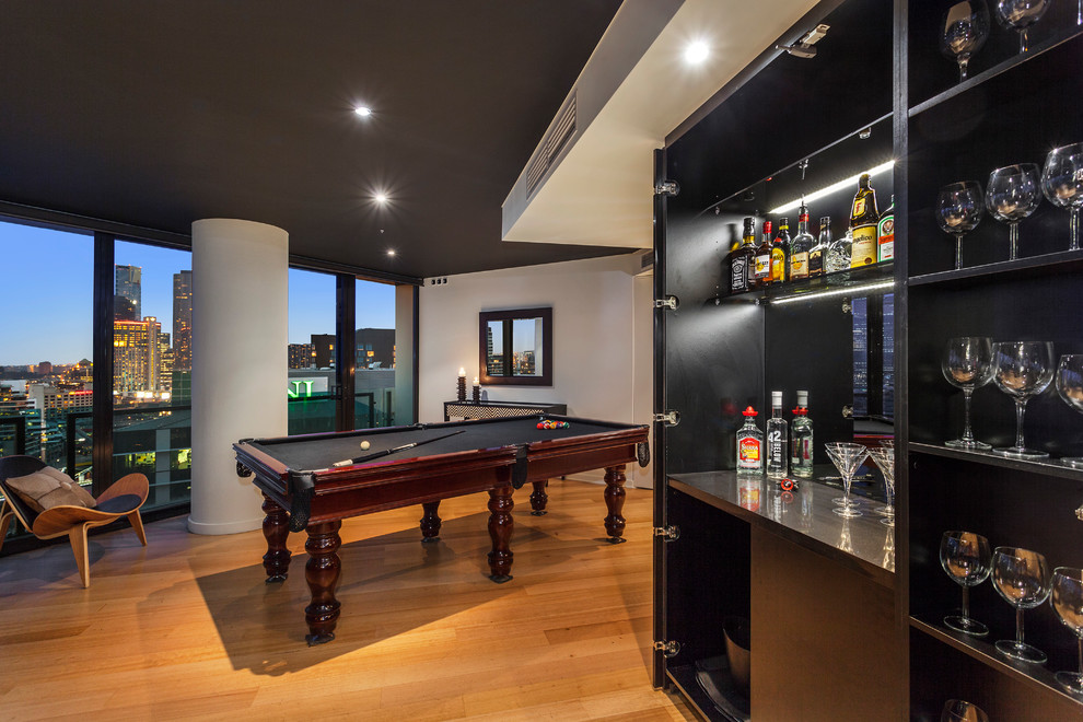 Design ideas for a large contemporary open plan games room in Melbourne with white walls and light hardwood flooring.