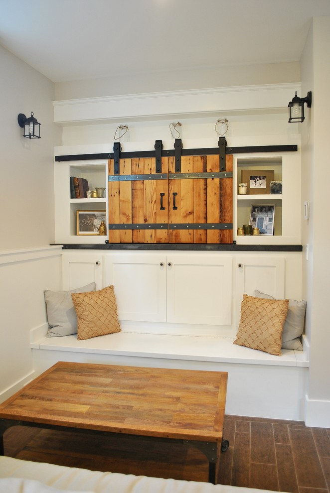Inspiration for a timeless family room remodel in Seattle with beige walls and a concealed tv