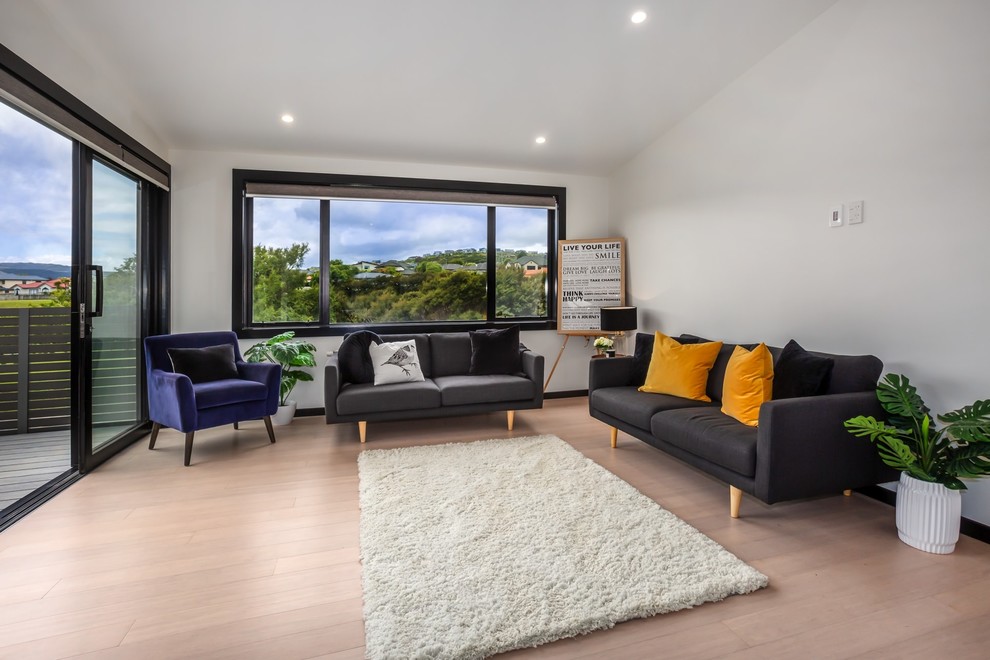 Inspiration for a scandinavian open concept bamboo floor family room remodel in Wellington
