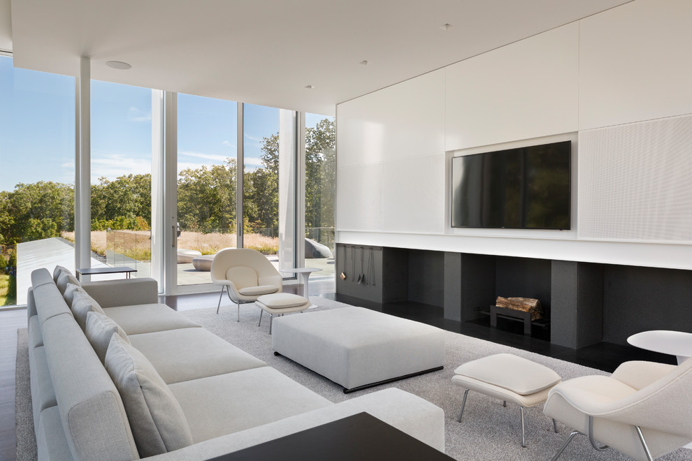 Foto di un grande soggiorno moderno con pareti bianche e TV a parete