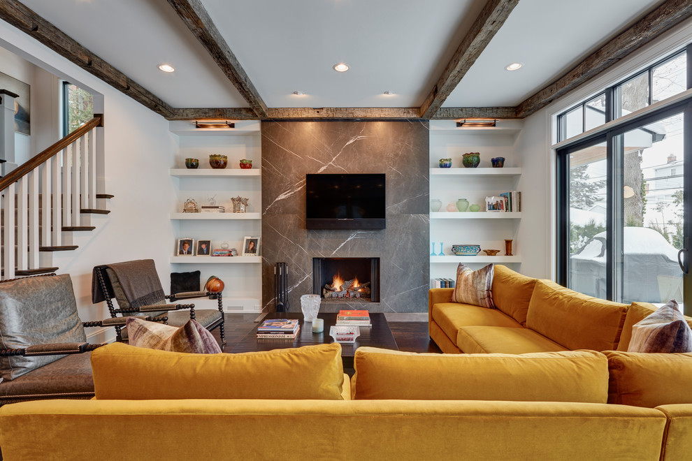 Contemporary games room in Detroit with white walls, dark hardwood flooring, a standard fireplace and a wall mounted tv.
