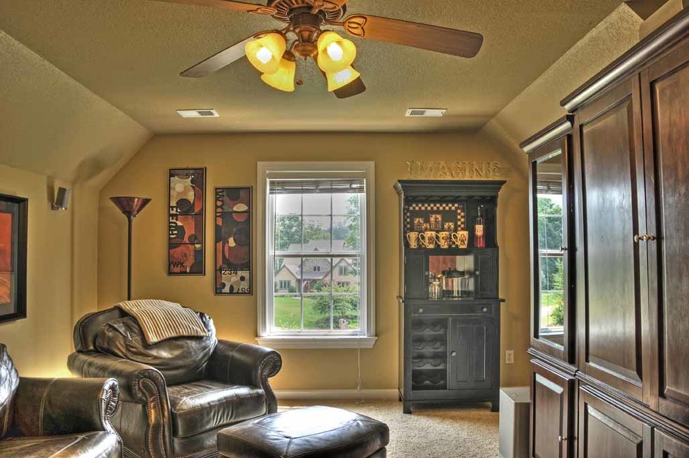 Example of a classic carpeted game room design in Other with brown walls