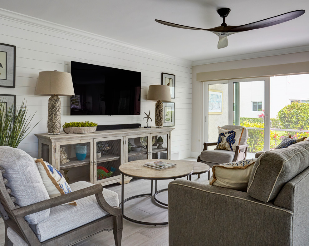 Small beach style open plan games room in Other with beige walls, porcelain flooring and grey floors.