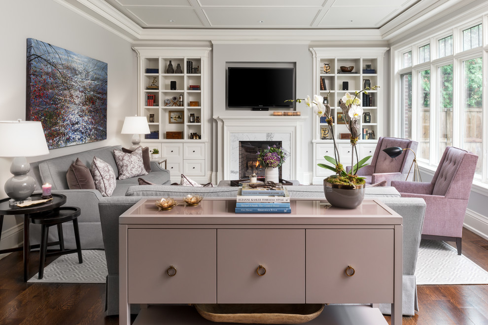 Design ideas for a large classic open plan games room in Toronto with grey walls, medium hardwood flooring, a standard fireplace, a stone fireplace surround and a built-in media unit.