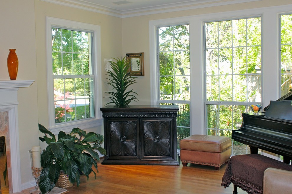 Family room - small traditional family room idea in Philadelphia with a music area and a concealed tv