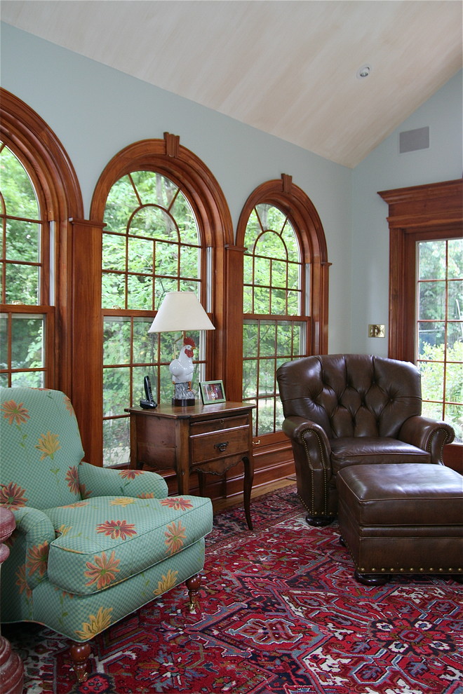 Example of a classic family room design in Cleveland with gray walls