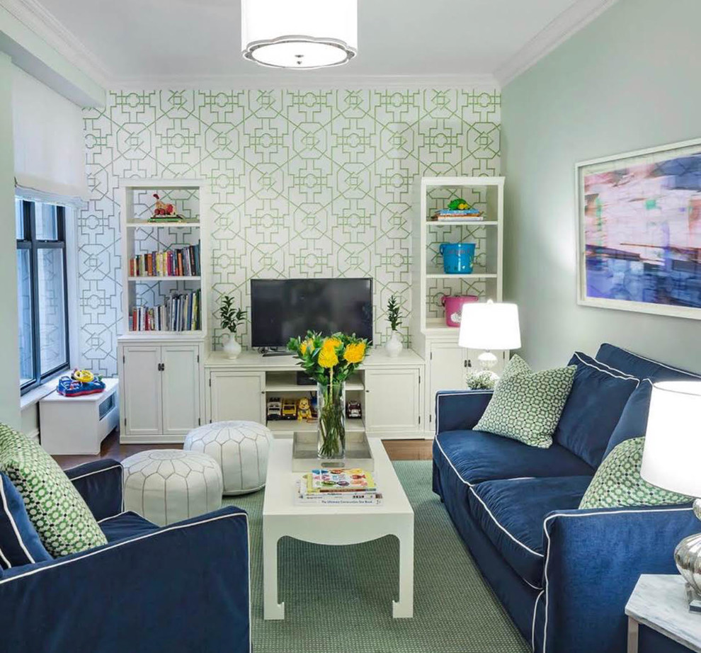 На фото: изолированная гостиная комната среднего размера в стиле неоклассика (современная классика) с с книжными шкафами и полками, зелеными стенами и ковровым покрытием