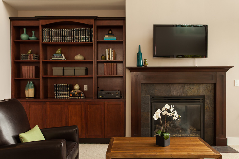 Example of a mid-sized trendy enclosed carpeted family room design in Seattle with a standard fireplace, a metal fireplace and a wall-mounted tv