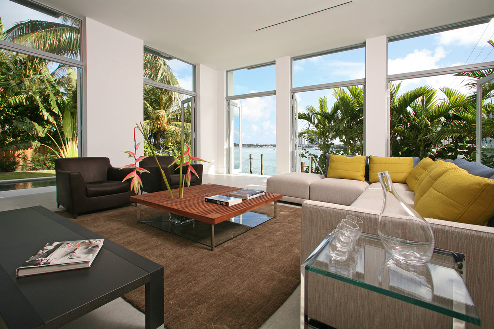 Example of a trendy family room design in Miami with white walls