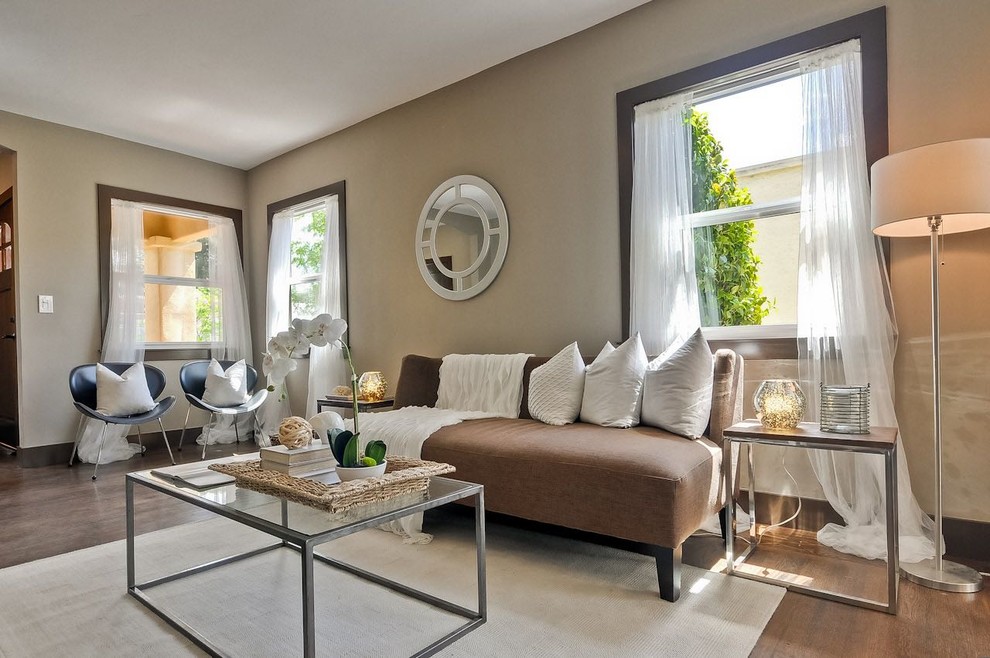 Medium sized traditional open plan games room in San Francisco with beige walls, dark hardwood flooring and brown floors.